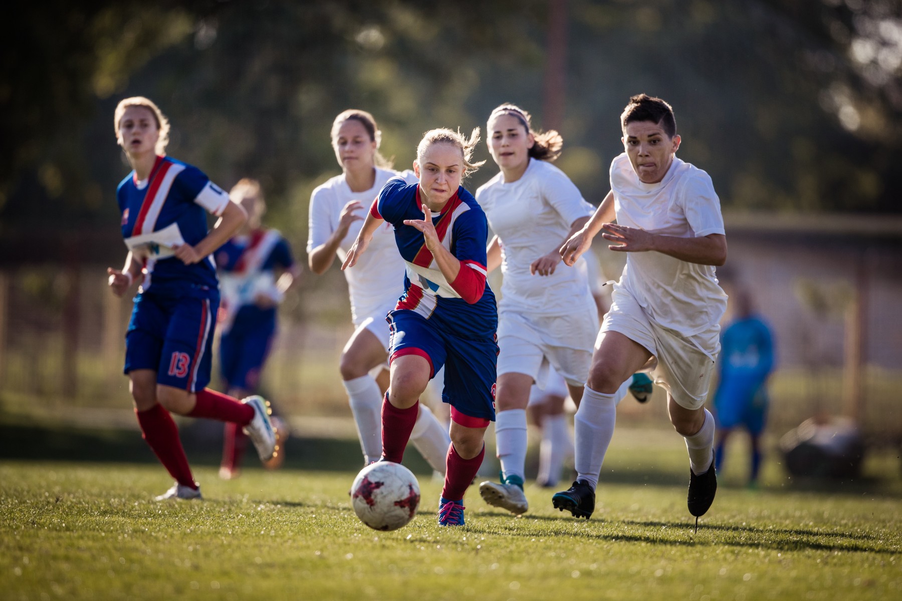 Youth soccer players competing on a field